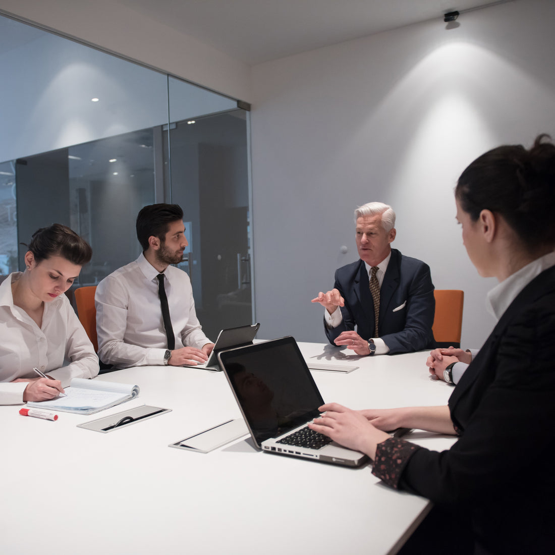 &lt;Recall committee of four senior employees, two male, two female, in a white wall and glass meeting room discussing the issue, with one keeping notes on a laptop. Credit&gt; AdobeStock_107493519