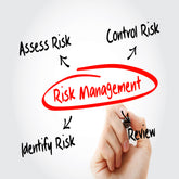 <Hand with a marker pen writing Risk Management in red in a bubble in the centre of a clear screen, with arrows in black pointing to the four stages, identify, assess, control, and review the risk. Credit> AdobeStock_173501135