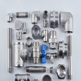 <Various chrome and stainles steel parts from the plumbing and waste system laid out in a square including valves, screw threads and l-shaped pipework. Credit> AdobeStock_218488774