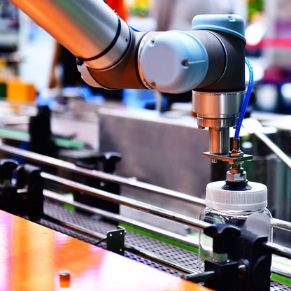 &lt;An ink jet coder arm on a production line being fed from a plastic bottle of black ink for spraying the batch number and expiry date on the bottle, tube or vial. Credit&gt; AdobeStock_326360926