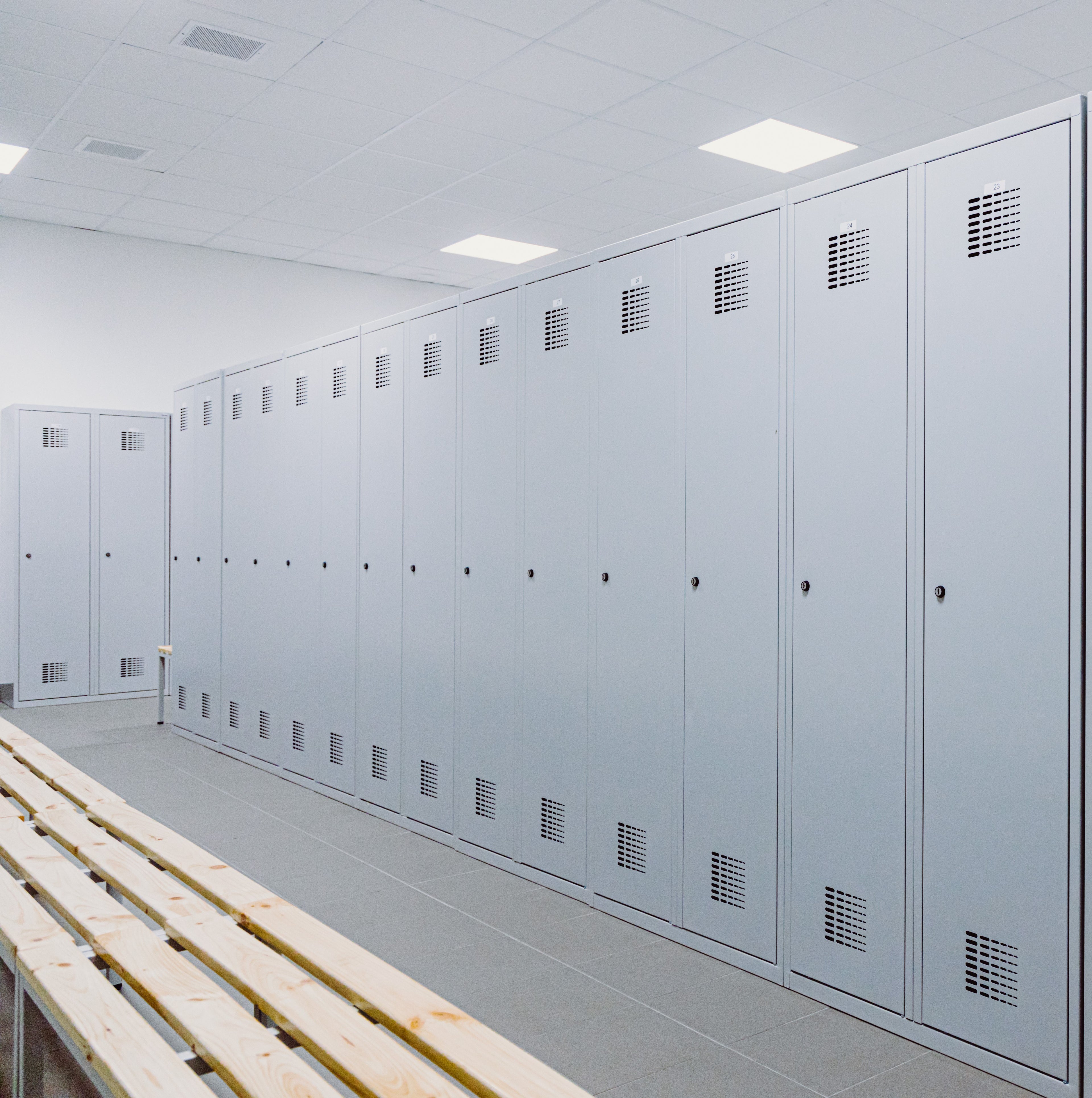 &lt;Clean, well ordered changing area for dietary supplement production staff including grey lockers for personal belongings and wooden benches. Credit&gt; AdobeStock_348001508