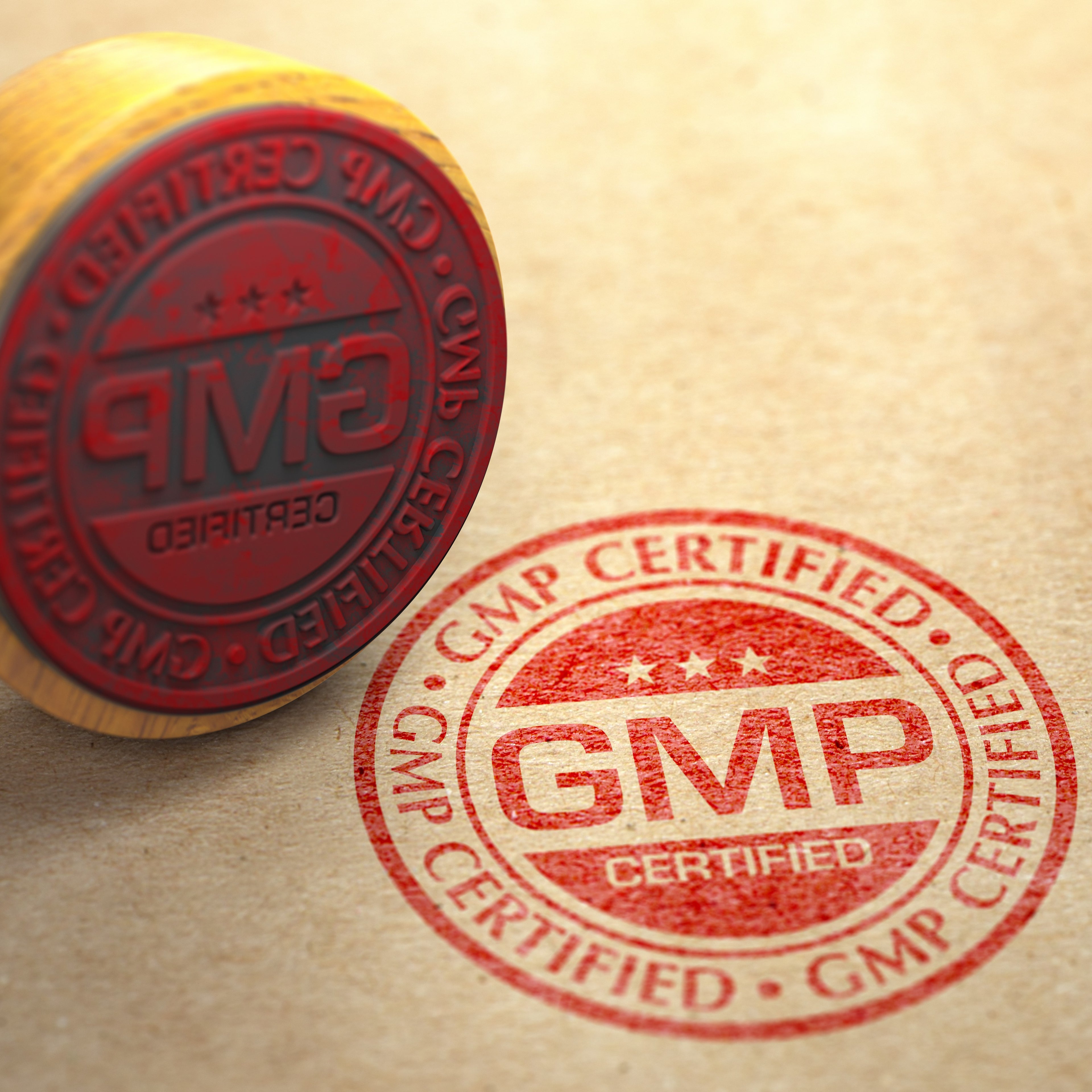 &lt;Round GMP Certified logo stamped on a brown envelope in red ink with the stamp lying next to it. Credit&gt; AdobeStock_413551778