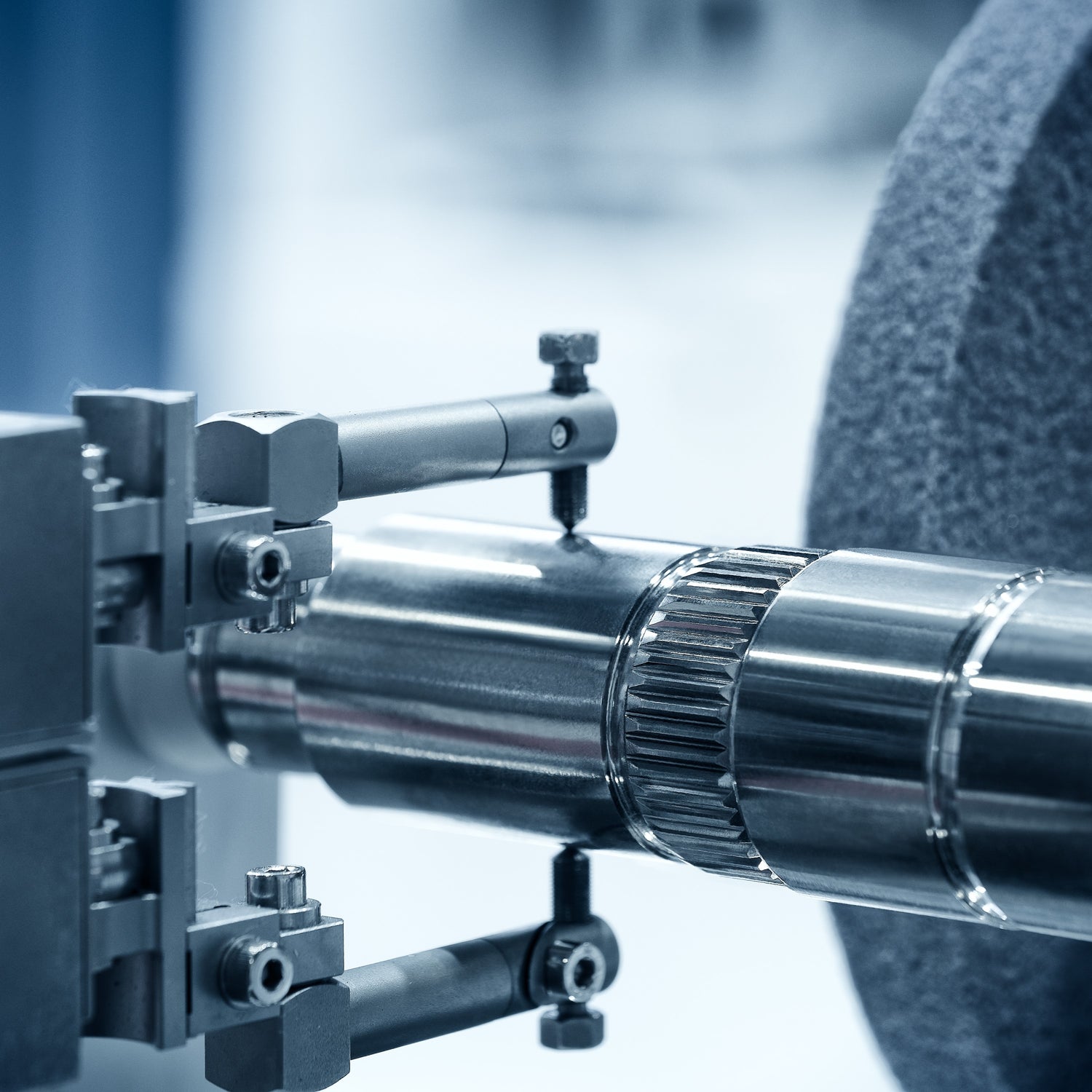 &lt;Measuring the dimensions on the shaft of a stainless steel rotary filling machine with a blurred white background. Credit&gt; AdobeStock_447971989