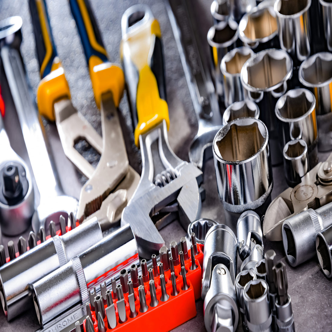 &lt;Maintenance Engineers tools including chrome socket spanner set, various screwdriver heads in an orange block, and socket wrench. Credit&gt; AdobeStock_461988008