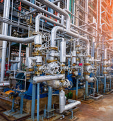 <Complex spaghetti of pipework  and manual shut off valves not labelled with their contents. Credit> AdobeStock_465693596