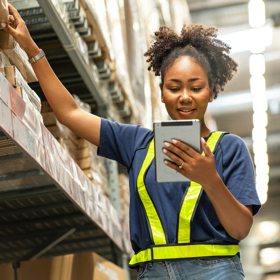 &lt;Smily female warehouse operator checking the location of drug labels on a tablet. Credit&gt; AdobeStock_534248242