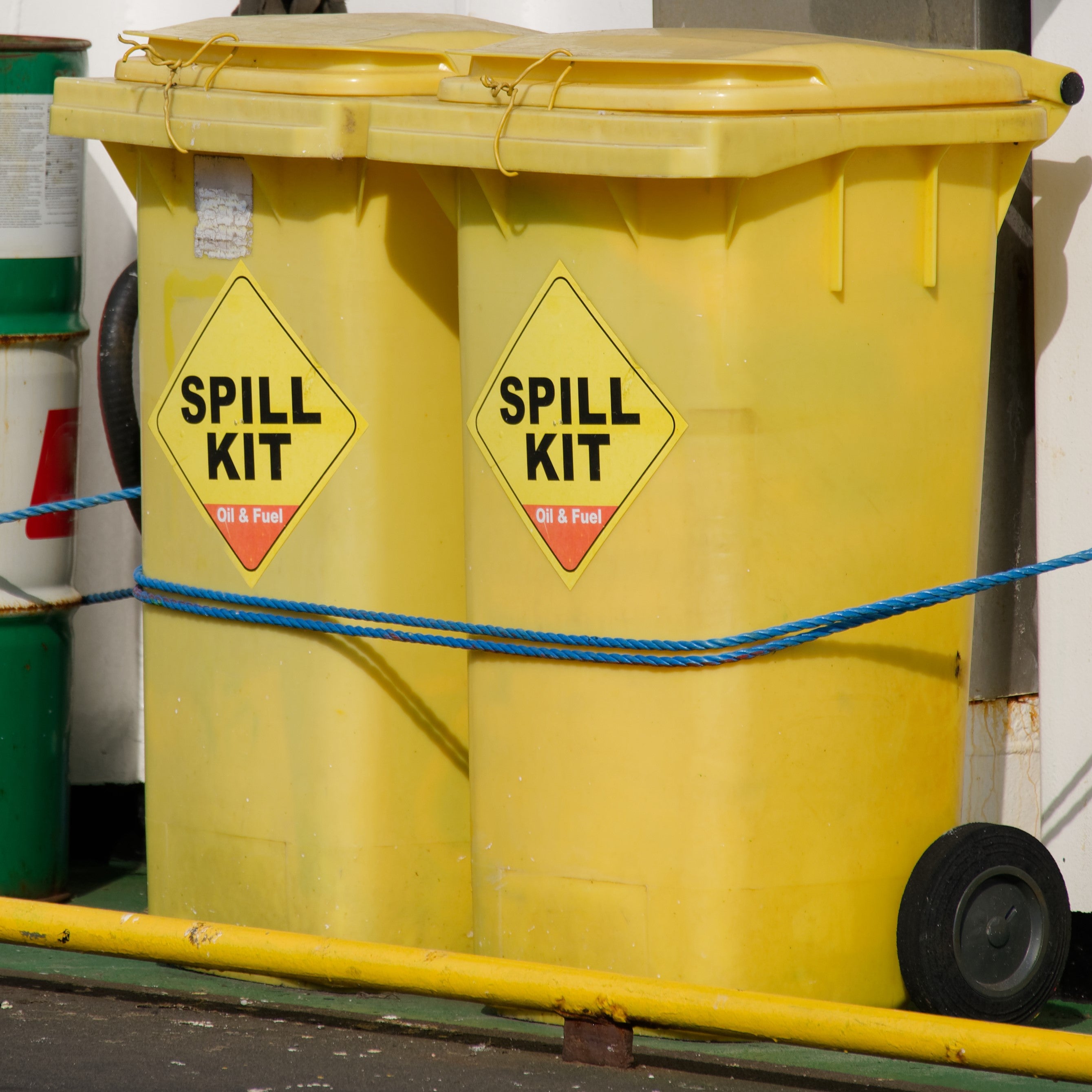 &lt;Two yellow wheelie bins containing Spill Kits for containing spillages from lorries in the yard of a dietary supplement facility. Credit&gt; AdobeStock_616771042