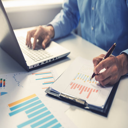 &lt;Male QA officer at a laptop on a desk by the window, reviewing trends in graphs as part of the product quality review. Credit&gt; 120496762 © Ronstik | Dreamstime.com