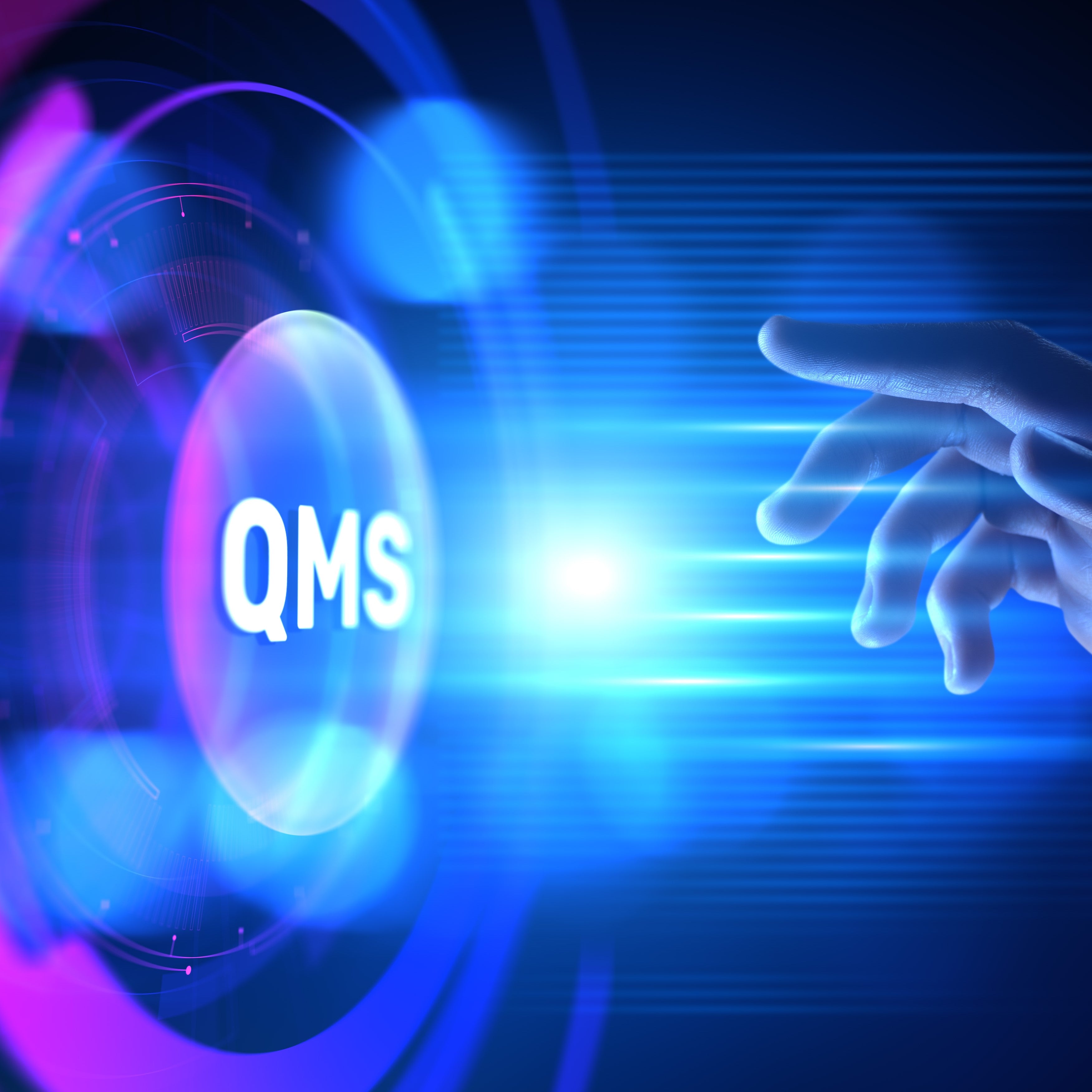 &lt;Hand reaching to press a big button labelled QMS in the middle of a round, futuristic, blue lit virtual screen. Credit&gt; 345437757 Kseniia Kolesnikova | Dreamstime.com