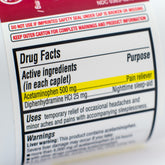 <Drugs facts label on a white bottle being inspected for claims and active ingredeint Acetaminophen vresus production and laboratory records. Credit> 53889861 © Kevin Giszewski | Dreamstime.com