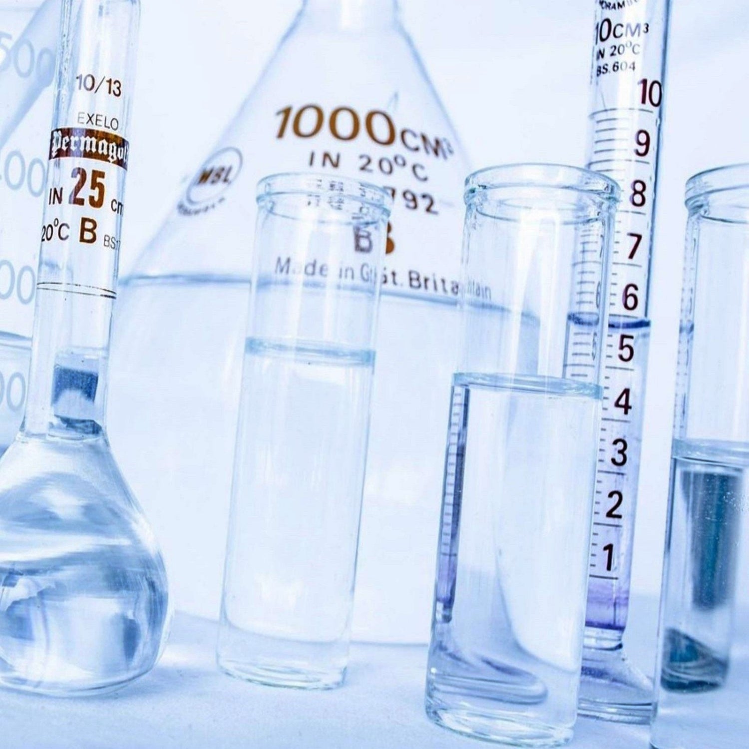 &lt;Selection of analytical grade, graduated laboratory glassware containing a clear colourless liquid including flasks, beakers, and measuring cylinders. Credit&gt; PublicDomainPictures @ Pixabay